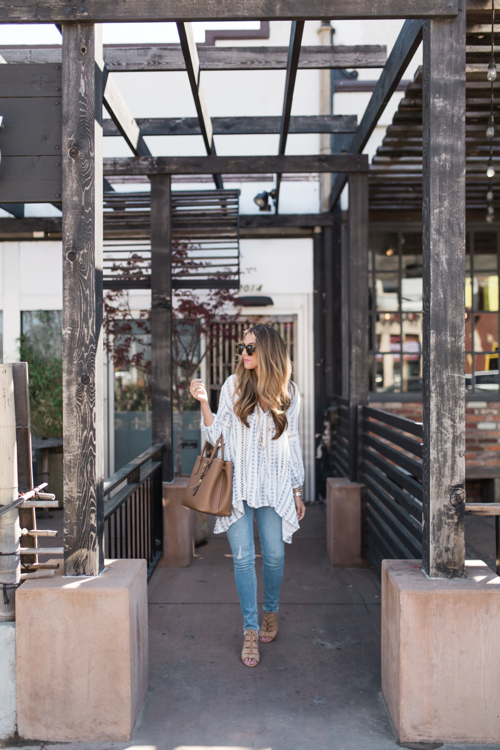 Ashley Robertson wearing lace up sandals 