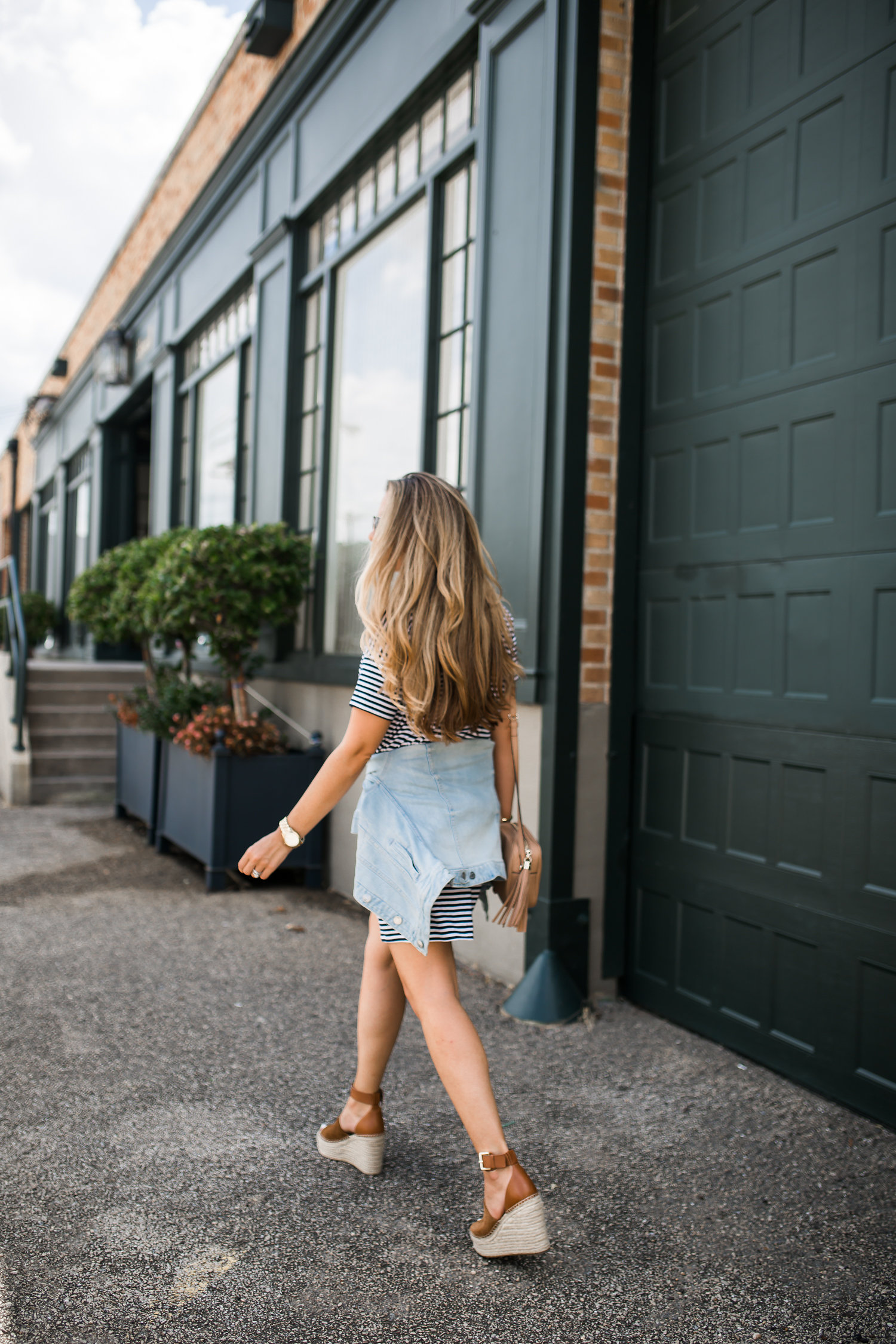 Ashley Robertson Denim Jacket Around the Waist 