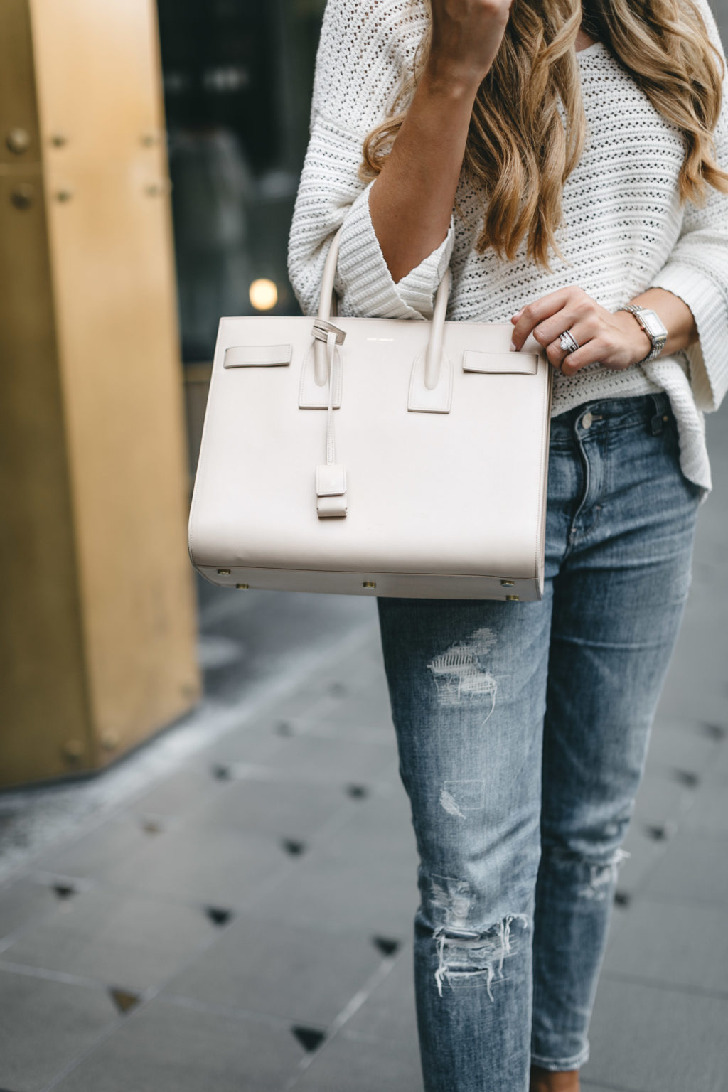 Saint Laurent bag and ripped jeans