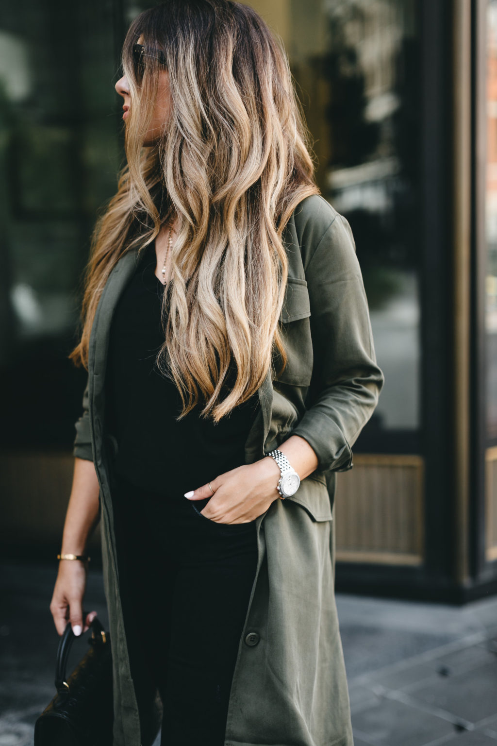 all black and an army green trench coat