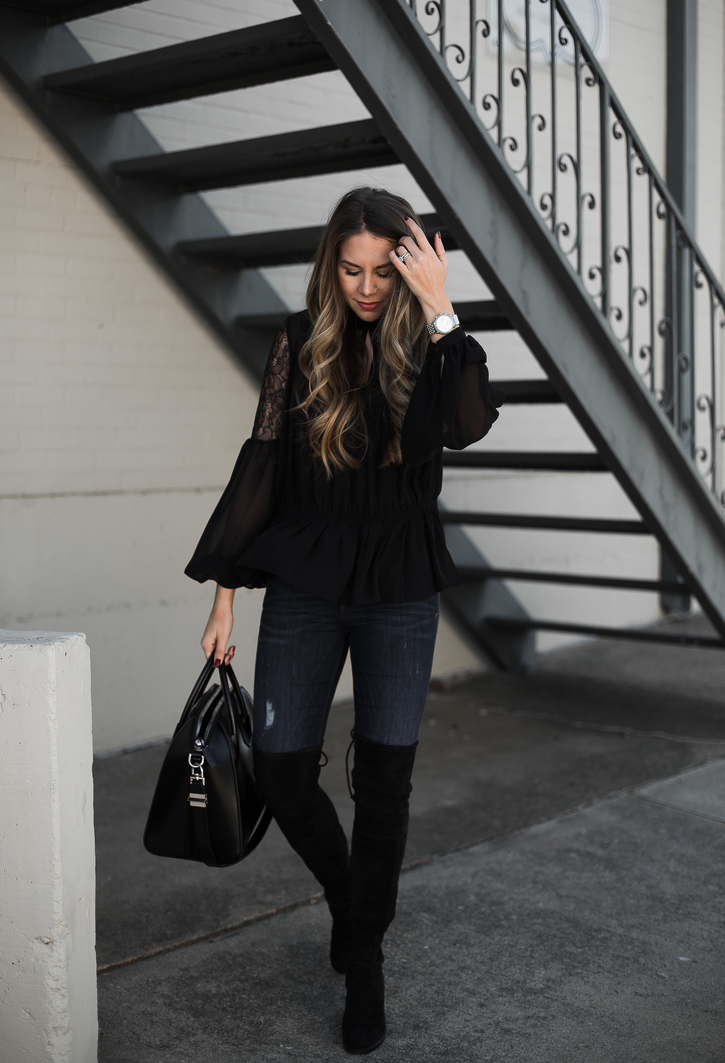 Over the knee boots and black blouse