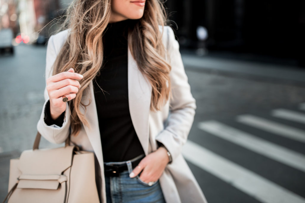 Black bodysuit and grey slim coat