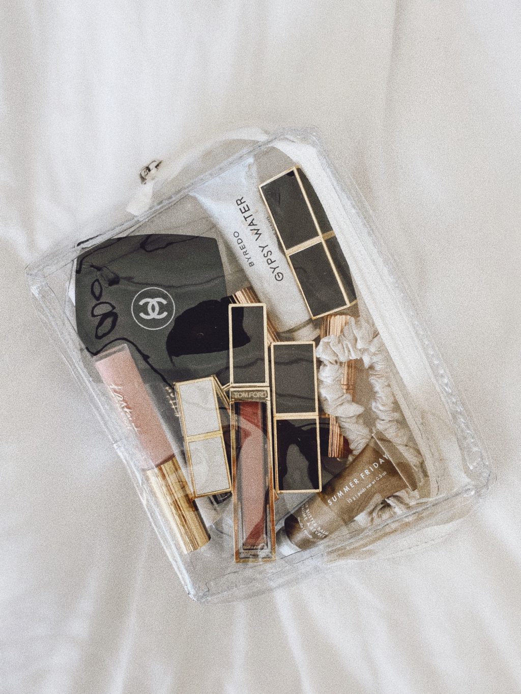 clear makeup bag flatlay